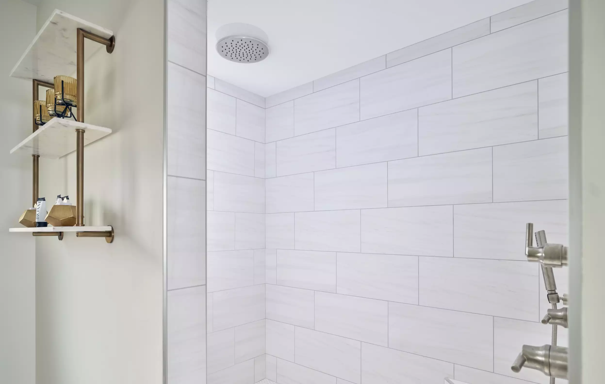 Walk in shower with a rainfall shower head and modern finishes